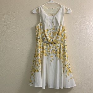 White dress with yellow flowers and crossing back